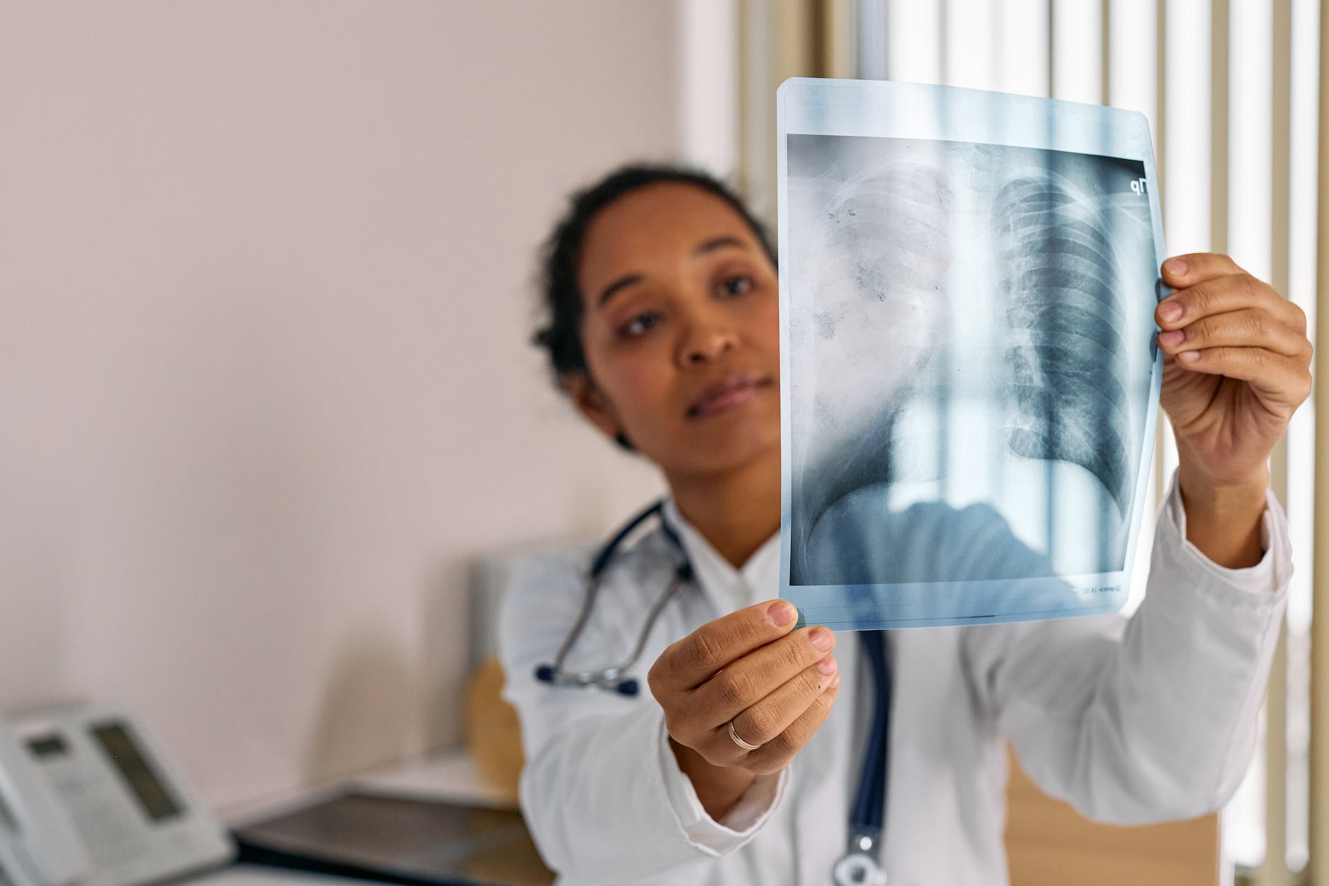 doctor looking at an x ray image of lungs